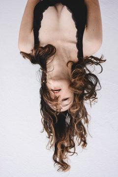 Portrait of young woman upside down