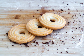 Bagel shortbread cookies on a wooden table. Shortbread Cookies bagel. Tasty Danish butter cookies. Bake at home. Homemade pastry.