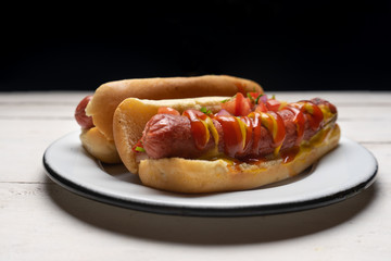 Hot dog with pico de gallo salad on white background
