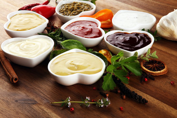 Sauces Assortment. Set of various sauces in bowls with ketchup, mayonnaise, pesto and mustard....