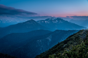 Naklejka premium Mountain panorama of the Alps under a full moon