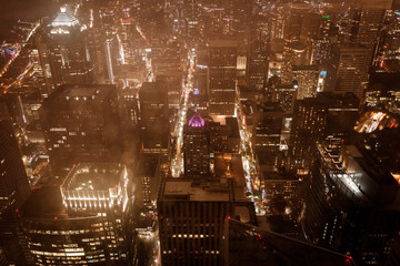 Top view of the city.Skyscrapers, streets, houses. Night, glowing lights, house Windows, lighting