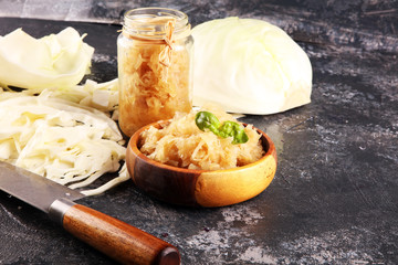 german sauerkraut (white fermented cabbage) Prepare sliced  or cut vegetable for cooking cabbage salad or coleslaw. Homemade food concept.