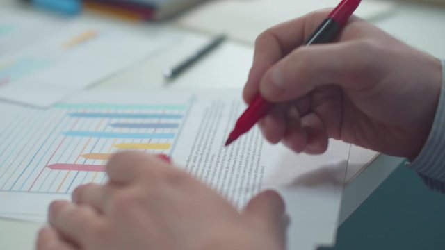 Office worker marks errors in the document