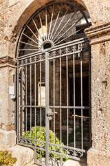Front door of the house within a house on island Bol, Brac, Dalmatia, Croatia on a sunny day in...
