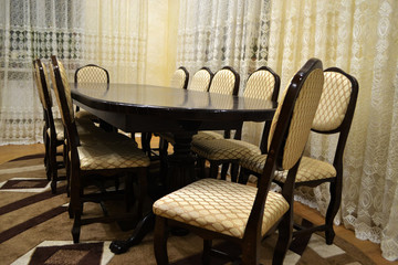 a large meeting table and many chairs nearby