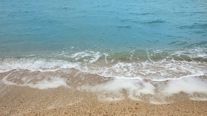 Fototapeta na wymiar Deserted sandy beach and sea