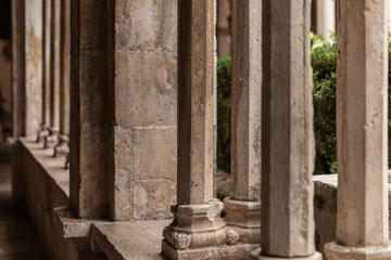 Decorative shaped columns with oranments in the 13th Century Franciscan Monastery cloister in the Old Town of Dubrovnik, Dalmatia, Croatia. Renaissance gothic style