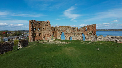 Aerial View of the Ludza Medieval Castle Ruins on a Hill Between Big Ludza Lake and Small Ludza Lake. The Ruins of an Ancient Castle in Latvia.