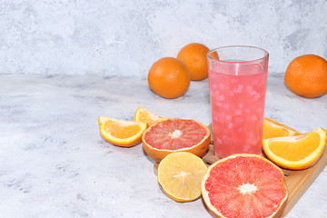 Fruit juice, cider and ingredients on a sunny table. The concept of detox diet and weight loss, healthy and natural nutrition, bar, lifestyle. Summer vitamin drinks.
