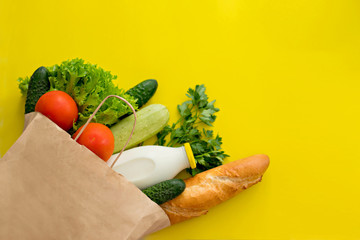 Healthy food background. Healthy vegan vegetarian food in paper bag vegetables and fruits on white, copy space, banner. Shopping food supermarket and clean vegan food concept.