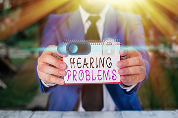 Writing note showing Hearing Problems. Business concept for is partial or total inability tolisten...