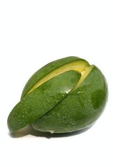 Closeup of Raw Mango with Water Drops Isolated on White Background in Vertical Orientation