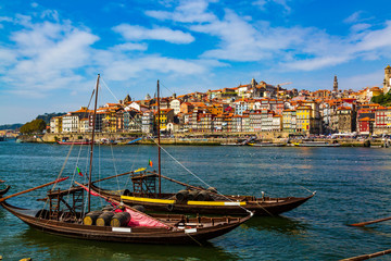 Fototapeta na wymiar Porto, Portugal, Riberia old town cityscape and the Douro River with traditional Rabelo boats