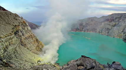 Ijen Volcano is an active volcano in Indonesia. In the heart of the volcano is not bubbling lava, but only quietly stretches turquoise lake	