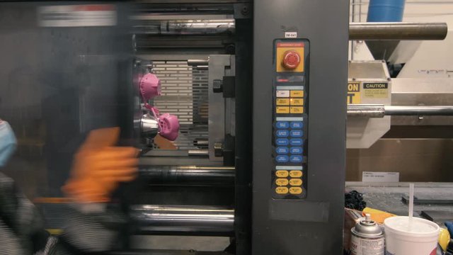 Injection molding machine makes face masks in American manufacturing factory
