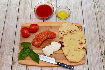 Pizza ingredients ready for making an easy home made dinner with  home delivered meal kit
