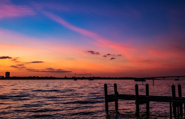 Fototapeta na wymiar sunset over the sea, sky, pier, water, clouds, landscape, orange, evening, dusk, horizon, 