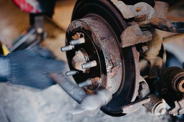 dismantling the brake disc of the car.
