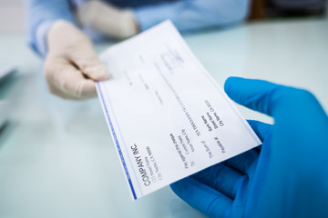Giving Cheque Of Payroll Check To Employee