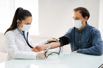Doctor Checking High Blood Pressure