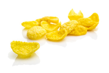Fototapeta na wymiar Isolated corn flakes on white. Snack Cereal yellow Healthy Cornflakes - Superfood background. Vegan gluten-free organic, healthy diet vegetarian superfood with antioxidant, mineral nutrients.