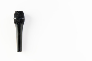 Professional black microphone isolated on white background, with available copy space.
