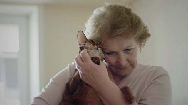 Older Woman With Her Cat
