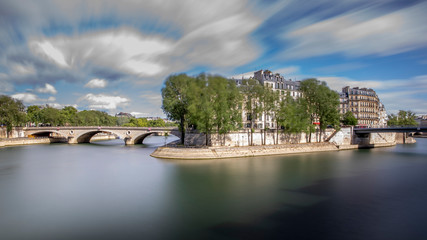 Obraz premium Paris, France - May 1, 2020: West end side of Ile St Louis in Paris. Long exposure photography