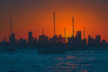 sunset water horizon miami florida sky port city buildings sea fishing boat dusk silhouette sun © Alberto GV PHOTOGRAP