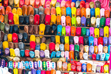Colourful soft leather slippers on display in the market shops in Marrakesh