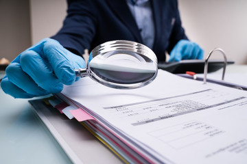 Business Fraud Investigation With Magnifying Glass
