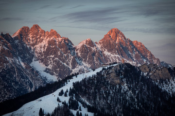 Mountains of mountain range Wilder Kaiser at Fieberbrunn during sunset in winter with snow, with...