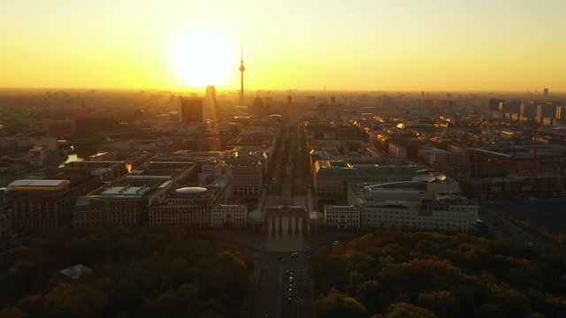 Berlin summer skyline aerial view of Brandenburger Tor - Brandeburg gate and television tower by sunset.