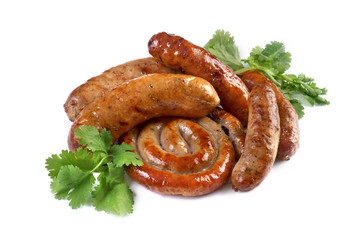 grilled sausages with herbs and spices on a white background