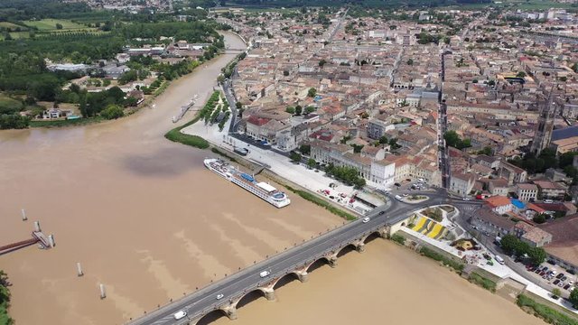 Panoramic aerial view of Libourne city on Dordogne river on sunny summer day, Gironde, France