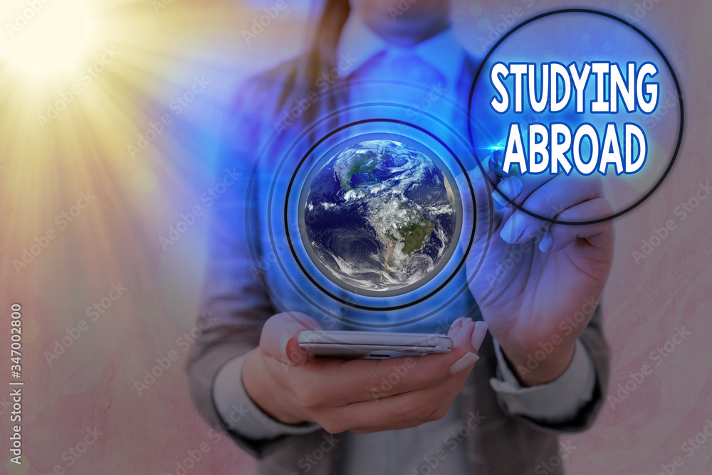 Poster writing note showing studying abroad. business concept for learn outside of home in foreign country 