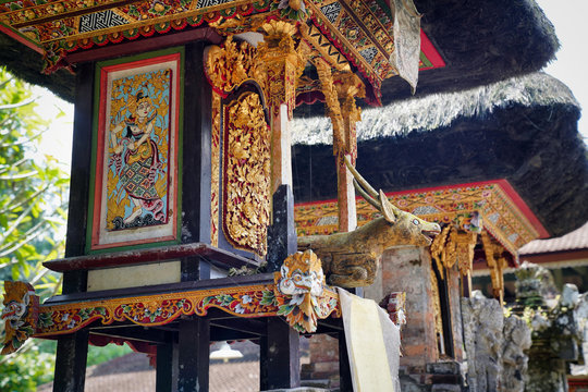 architecture of the temple complex in Indonesia with decorative wood carvings and art paintings