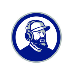Mascot icon illustration of head of a coach with beard, baseball cap and wearing headphones or headset looking forward to side set inside circle on isolated white background in retro style.