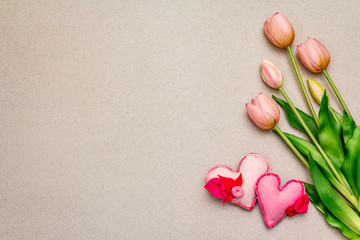 Greetings card, wallpaper, backdrop. Mothers Day, St.Valentines or Wedding. Gentle pink tulips, handmade felt hearts