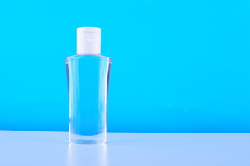 A portable alcohol spray bottle on white table