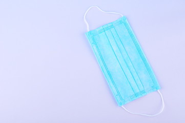 Blue Medical Disposable breath filter Face Mask with covid-19 with earloop. Covid-19 - Wuhan Novel Coronavirus pneumonia COVID-19. Surgical protective antiviral mask. Medical respiratory bandage face.