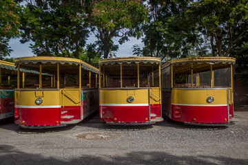 Fototapeta na wymiar Yellow trams in siam thailand park