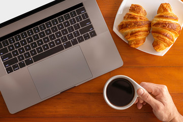 Home working enjoying a cup of coffee and a snack