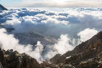 Clouds and fog over the Chamonix valley. View from the Cosmique refuge, Chamonix, France. Perfect...