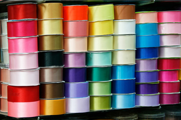 colorful ribbon rolls on shelf