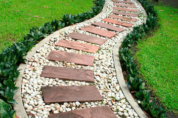 green grass and stone walkway in the park