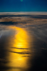 Fototapeta premium sunset over the sea on top of clouds