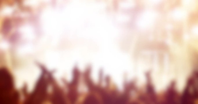 Big defocused crowd at music concert in slow motion with confetti and stage lights graphics elements 