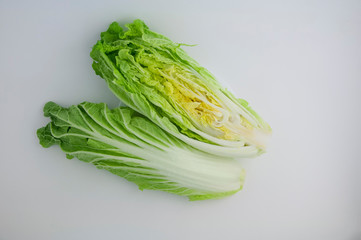 Chinese cabbage (in Japan called Hokusai) cut in poplam on a white isolated background close-up